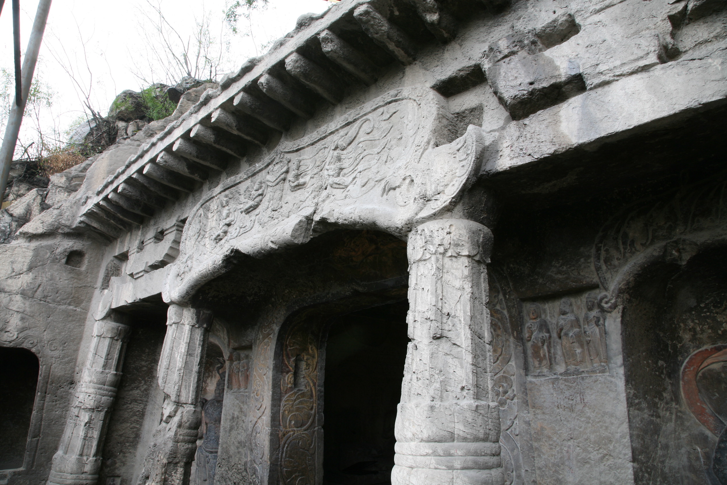 Xiangtangshan Cave 7 exterior, carved stone columns, brackets, and eave